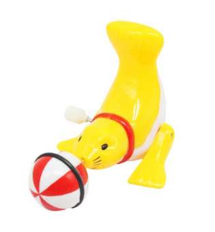 Заводна іграшка Тюлень з мʼячиком, жовта